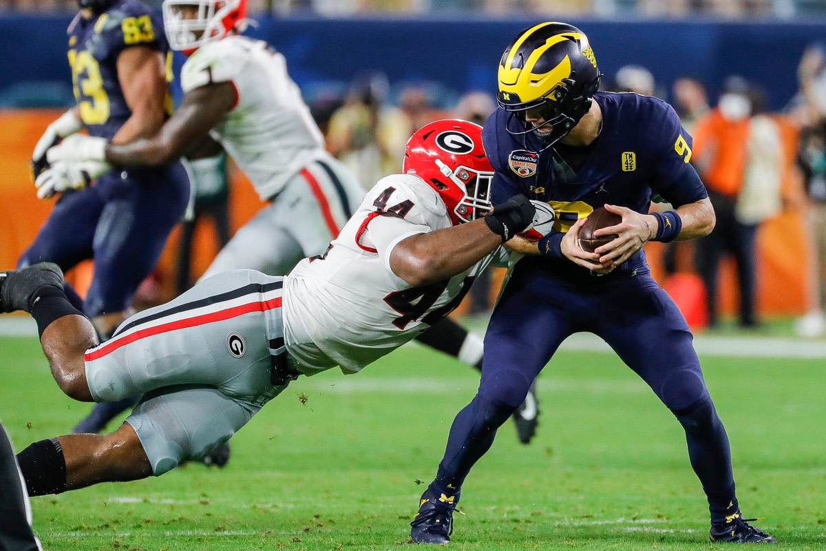 Georgia EDGE Travon Walker tackles Michigan quarterback
